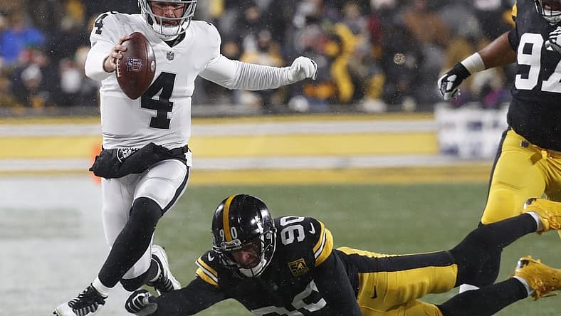 Dec 24, 2022; Pittsburgh, Pennsylvania, USA; Las Vegas Raiders quarterback Derek Carr (4) runs the ball as Pittsburgh Steelers linebacker T.J. Watt (90) defends during the first quarter at Acrisure Stadium. Mandatory Credit: Charles LeClaire-USA TODAY Sports