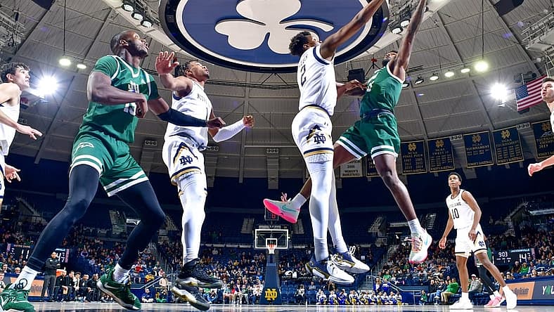Dec 27, 2022; South Bend, Indiana, USA; Notre Dame Fighting Irish forward Ven-Allen Lubin (2) blocks the shot attempt by Jacksonville Dolphins guard Jordan Davis (11) in the first half at the Purcell Pavilion. Mandatory Credit: Matt Cashore-USA TODAY Sports