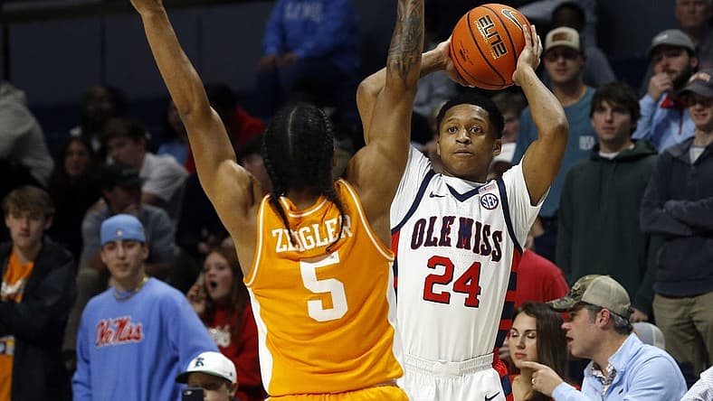 Dec 28, 2022; Oxford, Mississippi, USA; Mississippi Rebels guard Daeshun Ruffin (24) passes the ball against Tennessee Volunteers guard Zakai Zeigler (5) during the first half at The Sandy and John Black Pavilion at Ole Miss. Mandatory Credit: Petre Thomas-USA TODAY Sports