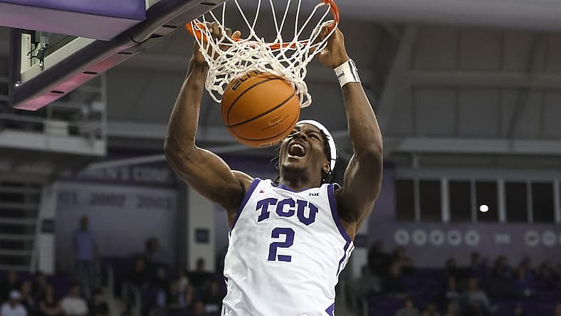 Dec 28, 2022; Fort Worth, Texas, USA; TCU Horned Frogs forward Emanuel Miller (2) dunks during the second half against the Central Arkansas Bears at Ed and Rae Schollmaier Arena. Mandatory Credit: Kevin Jairaj-USA TODAY Sports