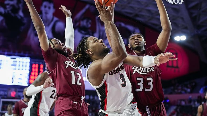 Dec 28, 2022; Athens, Georgia, USA; Georgia Bulldogs guard Kario Oquendo (3) shoots over Rider Broncs forward Tariq Ingraham (33) during the first half at Stegeman Coliseum. Mandatory Credit: Dale Zanine-USA TODAY Sports