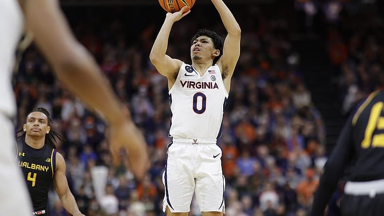 Dec 28, 2022; Charlottesville, Virginia, USA; Virginia Cavaliers guard Kihei Clark (0) shoots the ball against the Albany Great Danes in the second half at John Paul Jones Arena. Mandatory Credit: Geoff Burke-USA TODAY Sports