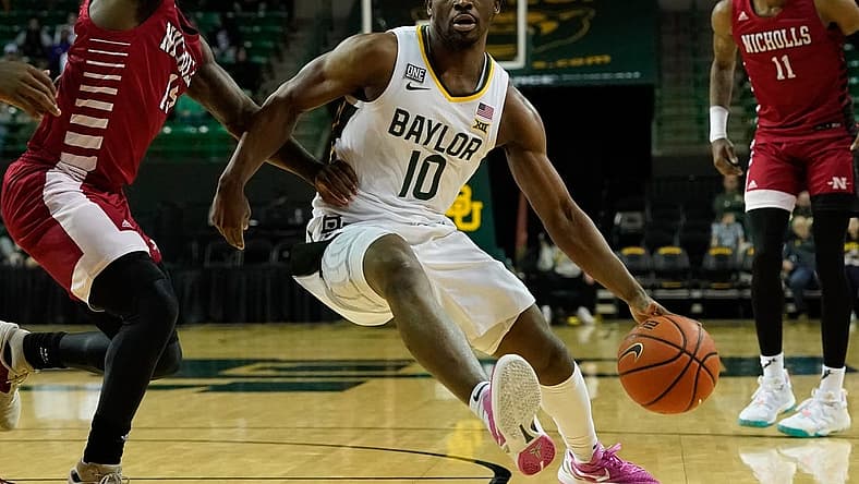 Dec 28, 2022; Waco, Texas, USA; Baylor Bears guard Adam Flagler (10) drives to the basket against the Nicholls State Colonels during the first half at Ferrell Center. Mandatory Credit: Chris Jones-USA TODAY Sports