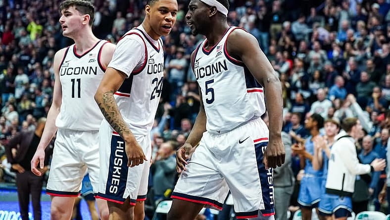 Dec 28, 2022; Hartford, Connecticut, USA; Connecticut Huskies guard Jordan Hawkins (24) and guard Hassan Diarra (5) react after a play against the Villanova Wildcats during the second half at XL Center. Mandatory Credit: David Butler II-USA TODAY Sports