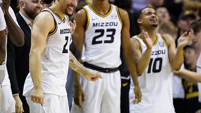 Dec 28, 2022; Columbia, Missouri, USA; Missouri Tigers guard Tre Gomillion (2) and forward Aidan Shaw (23) and guard Nick Honor (10) celebrate late in the second half against the Kentucky Wildcats at Mizzou Arena. Mandatory Credit: Jay Biggerstaff-USA TODAY Sports