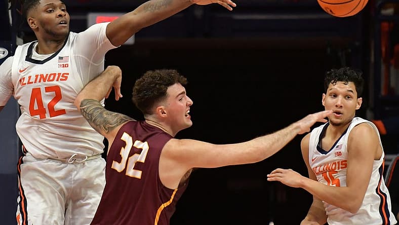 Dec 29, 2022; Champaign, Illinois, USA; Illinois Fighting Illini forward Dain Dainja (42) blocks the shot of Bethune-Cookman Wildcats center Elijah Hulsewe (32) during the first half at State Farm Center. Mandatory Credit: Ron Johnson-USA TODAY Sports