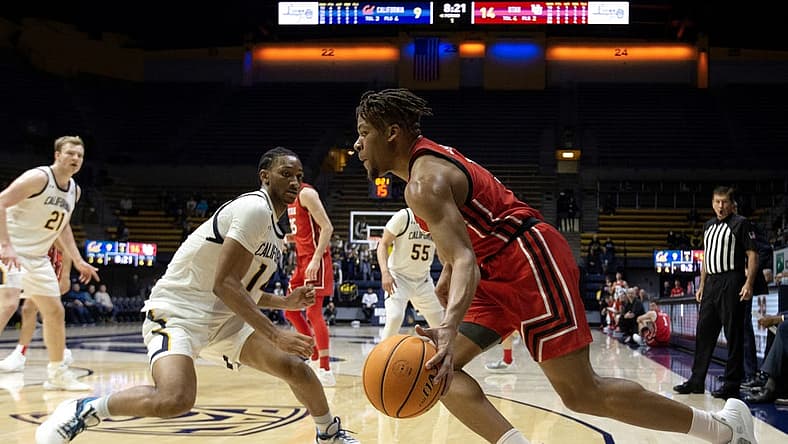 Dec 29, 2022; Berkeley, California, USA; Utah Utes guard Wilguens Jr. Exacte (11) drives the baseline past California Golden Bears forward Grant Newell (14) during the first half at Haas Pavilion. Mandatory Credit: D. Ross Cameron-USA TODAY Sports
