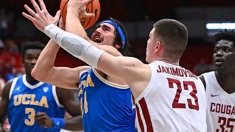 Dec 30, 2022; Pullman, Washington, USA; UCLA Bruins guard Jaime Jaquez Jr. (24) shoots the ball against Washington State Cougars forward Andrej Jakimovski (23) in the second half at Friel Court at Beasley Coliseum. Bruins won 67-66. Mandatory Credit: James Snook-USA TODAY Sports