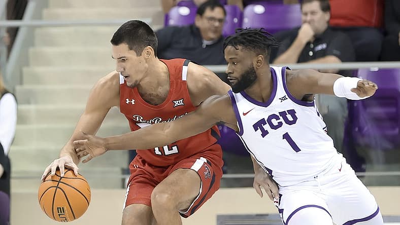 Dec 31, 2022; Fort Worth, Texas, USA; Texas Tech Red Raiders forward Daniel Batcho (12) tries to control the ball as TCU Horned Frogs guard Mike Miles Jr. (1) defends during the first half at Ed and Rae Schollmaier Arena. Mandatory Credit: Kevin Jairaj-USA TODAY Sports