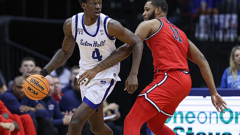 Dec 31, 2022; Newark, New Jersey, USA; Seton Hall Pirates forward Tyrese Samuel (4) dribbles as St. John's Red Storm center Joel Soriano (11) defends during the first half at Prudential Center. Mandatory Credit: Vincent Carchietta-USA TODAY Sports