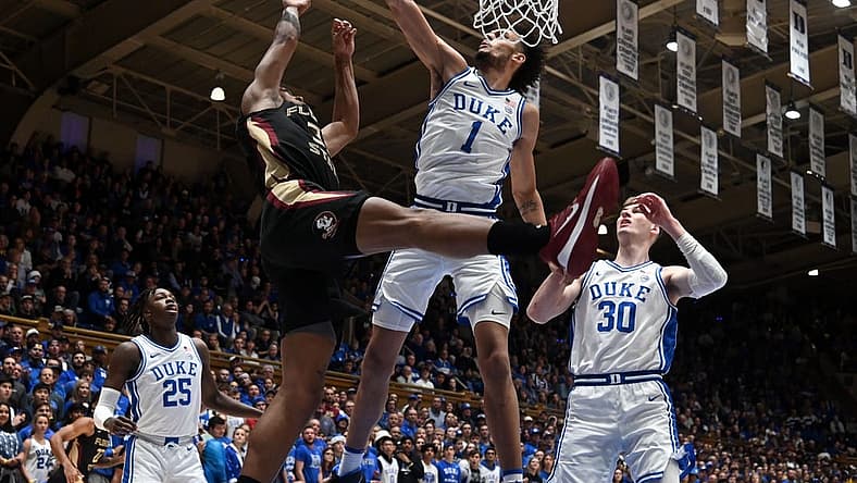 Dec 31, 2022; Durham, North Carolina, USA; Duke Blue Devils center Dereck Lively (1) blocks the shot of Florida State Seminoles guard Matthew Cleveland (35) during the first half at Cameron Indoor Stadium. Mandatory Credit: Rob Kinnan-USA TODAY Sports