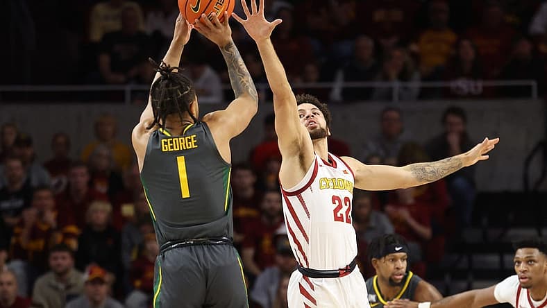 Dec 31, 2022; Ames, Iowa, USA; Iowa State Cyclones guard Gabe Kalscheur (22) defends the shot from Baylor Bears guard Keyonte George (1) at James H. Hilton Coliseum. Mandatory Credit: Reese Strickland-USA TODAY Sports