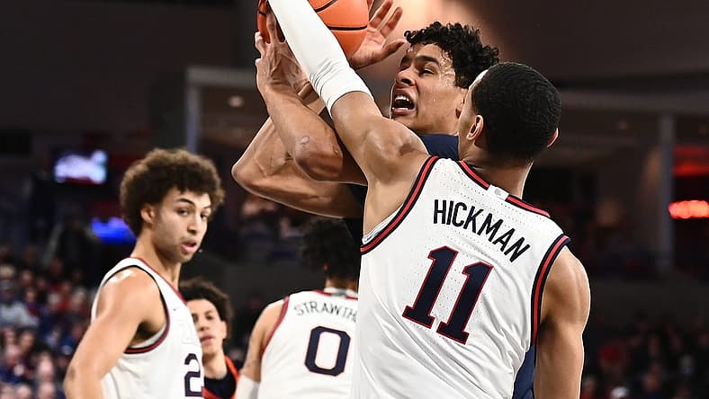 Dec 31, 2022; Spokane, Washington, USA; Pepperdine Waves forward Jevon Porter (14) is fouled by Gonzaga Bulldogs guard Nolan Hickman (11) in the first half at McCarthey Athletic Center. Mandatory Credit: James Snook-USA TODAY Sports