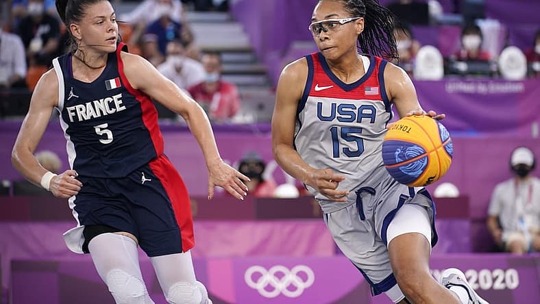 Jul 28, 2021; Tokyo, Japan; USA player Allisha Gray (15) dribbles while being defended by France player Marie-Eve Paget (5) in the semifinal game during the Tokyo 2020 Olympic Summer Games at Aomi Urban Sports Park. Mandatory Credit: Andrew Nelles-USA TODAY Sports