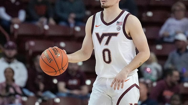 Nov 18, 2022; Charleston, South Carolina, USA; Virginia Tech Hokies guard Hunter Cattoor (0) brings the ball up court in the first half against the Penn State Nittany Lions at TD Arena. Mandatory Credit: David Yeazell-USA TODAY Sports
