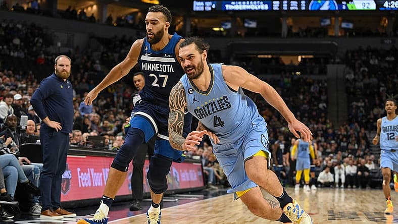 Nov 30, 2022; Minneapolis, Minnesota, USA;  Minnesota Timberwolves center Rudy Gobert (27) and Memphis Grizzlies center Steven Adams (4) race after a loose ball during the fourth quarter at Target Center. Mandatory Credit: Nick Wosika-USA TODAY Sports
