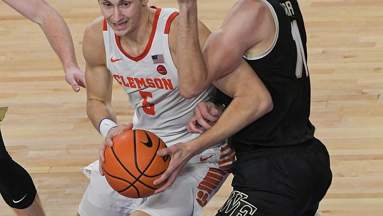 Dec 2, 2022; Clemson, SC, USA; Clemson forward Hunter Tyson (5) gets ready to shoot near Wake Forest forward Andrew Carr (11) during the second half at Littlejohn Coliseum Friday, December 2, 2022. Mandatory Credit: Ken Ruinard/USA TODAY-USA TODAY NETWORK