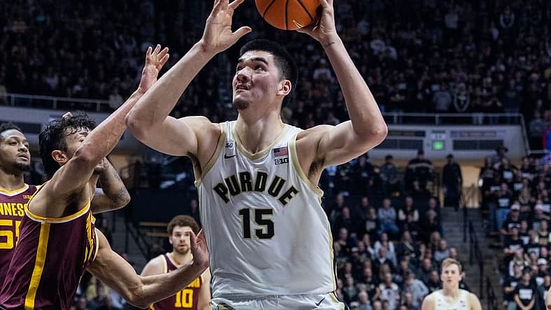 Dec 4, 2022; West Lafayette, Indiana, USA; Purdue Boilermakers center Zach Edey (15) shoots the ball while Minnesota Golden Gophers forward Dawson Garcia (3) defends in the second half at Mackey Arena. Mandatory Credit: Trevor Ruszkowski-USA TODAY Sports