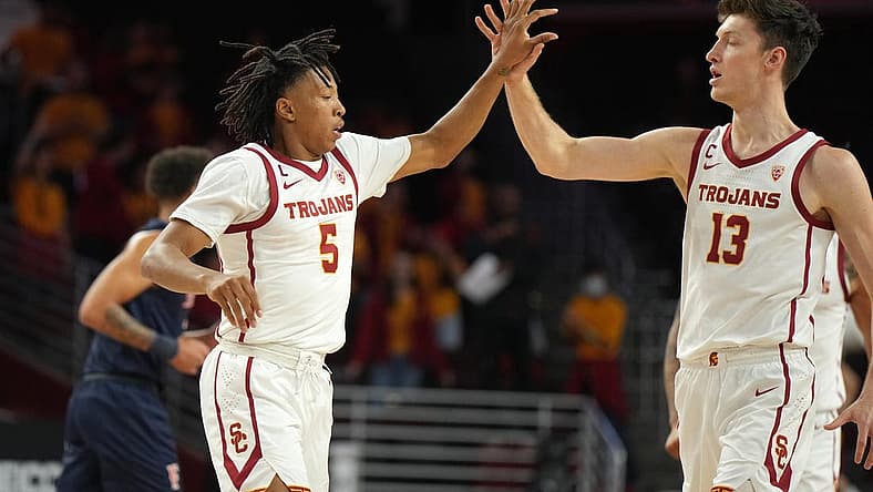 Dec 7, 2022; Los Angeles, California, USA; Southern California Trojans guard Boogie Ellis (5) and guard Drew Peterson (13) celebrate against the Cal State Fullerton Titans in the first half at Galen Center. Mandatory Credit: Kirby Lee-USA TODAY Sports