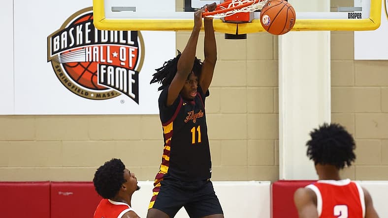 Dec 8, 2022; Scottsdale, AZ, USA; Cardinal Hayes Cardinals guard Ian Jackson (11) slam dunks the ball against the Duncanville High School Panthers during the HoopHall West basketball tournament at Chaparral High School. Mandatory Credit: Mark J. Rebilas-USA TODAY Sports