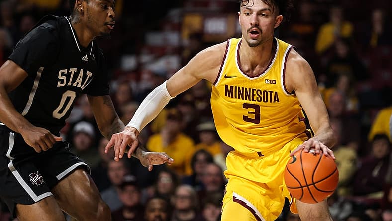 Dec 11, 2022; Minneapolis, Minnesota, USA; Minnesota Golden Gophers forward Dawson Garcia (3) dribbles the ball while Mississippi State Bulldogs forward D.J. Jeffries (0) defends during the first half at Williams Arena. Mandatory Credit: Matt Krohn-USA TODAY Sports