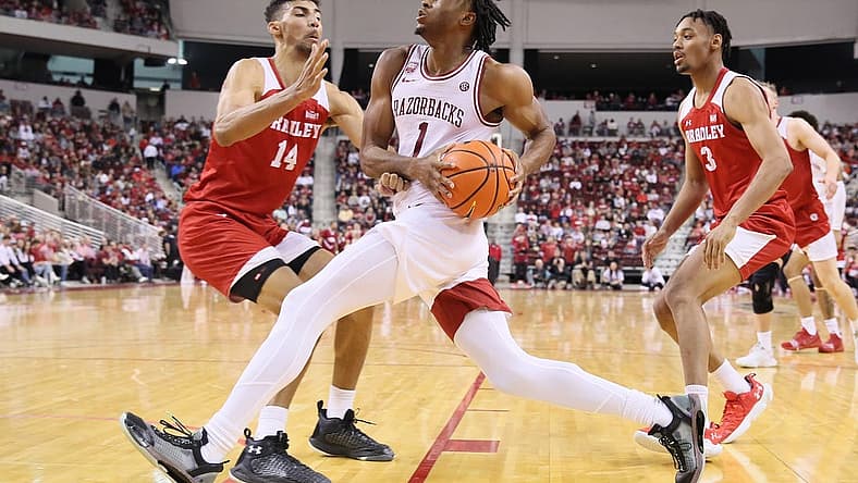 Dec 17, 2022; North Little Rock, Arkansas, USA; Arkansas Razorbacks guard Ricky Council IV (1) drives to the basket as Bradley Braves forward Malevy Leons (14) and guard Zek Montgomery (3) defend in the second half at Simmons Bank Arena. Arkansas won 76-57. Mandatory Credit: Nelson Chenault-USA TODAY Sports