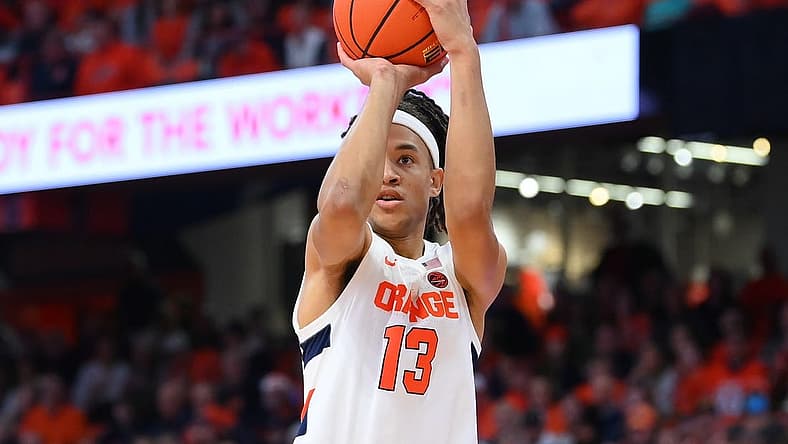Dec 17, 2022; Syracuse, New York, USA; Syracuse Orange forward Benny Williams (13) shoots the ball against the Cornell Big Red during the first half at the JMA Wireless Dome. Mandatory Credit: Rich Barnes-USA TODAY Sports