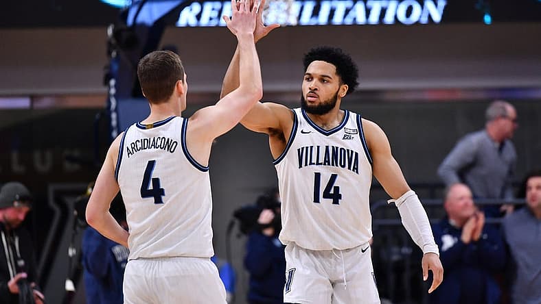 Dec 21, 2022; Villanova, Pennsylvania, USA; Villanova Wildcats guard Caleb Daniels (14) and guard Chris Arcidiacono (4) celebrate after the game against the Saint John's Red Storm at William B. Finneran Pavilion. Mandatory Credit: Kyle Ross-USA TODAY Sports