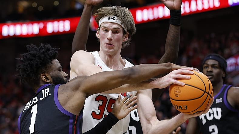 Dec 21, 2022; Salt Lake City, Utah, USA; TCU Horned Frogs guard Mike Miles Jr. (1) and Utah Utes center Branden Carlson (35) battle in the second half at Vivint Arena. Mandatory Credit: Jeffrey Swinger-USA TODAY Sports