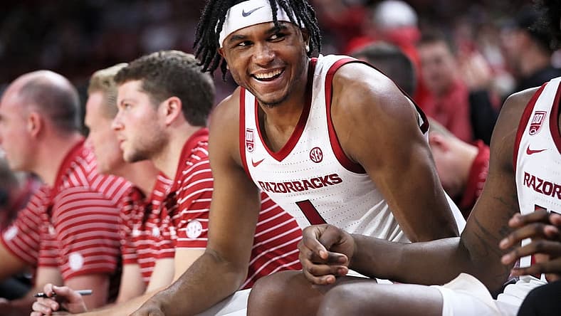 Dec 21, 2022; Fayetteville, Arkansas, USA; Arkansas Razorbacks guard Ricky Council IV celebrates from the bench during the second half against the UNC Asheville Bulldogs at Bud Walton Arena. Arkansas won 85-51. Mandatory Credit: Nelson Chenault-USA TODAY Sports