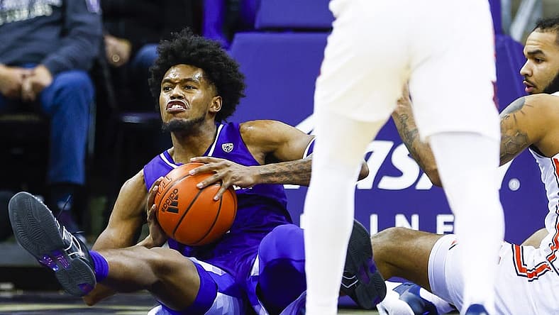Dec 21, 2022; Seattle, Washington, USA; Washington Huskies forward Keion Brooks (1) attempts to pass after collecting a loose ball against Auburn Tigers forward Johni Broome (4) during the second half at Alaska Airlines Arena at Hec Edmundson Pavilion. Mandatory Credit: Joe Nicholson-USA TODAY Sports