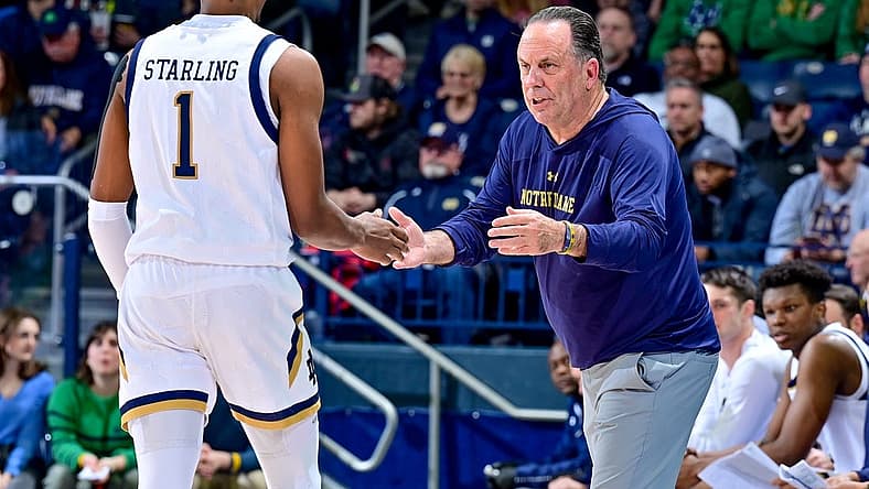 Dec 27, 2022; South Bend, Indiana, USA; Notre Dame Fighting Irish head coach Mike Brey talks to guard JJ Starling (1) in the first half against the Jacksonville Dolphins at the Purcell Pavilion. Mandatory Credit: Matt Cashore-USA TODAY Sports