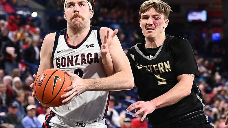 Dec 28, 2022; Spokane, Washington, USA; Gonzaga Bulldogs forward Drew Timme (2) is fouled by Eastern Oregon Mountaineers guard Preston Chandler (5) in the second half at McCarthey Athletic Center. Mandatory Credit: James Snook-USA TODAY Sports