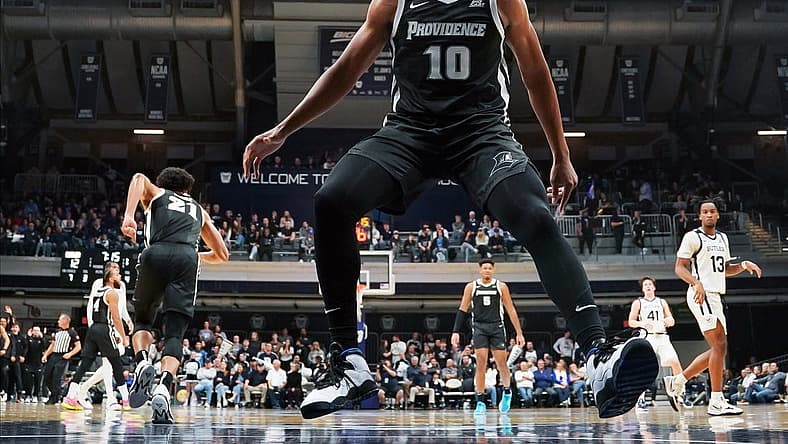Dec 29, 2022; Indianapolis, Indiana, USA;  Providence Friars guard Noah Locke (10) celebrates after a dunk by Providence Friars guard Devin Carter (22) against the Butler Bulldogs during the first half at Hinkle Fieldhouse. Mandatory Credit: Robert Goddin-USA TODAY Sports