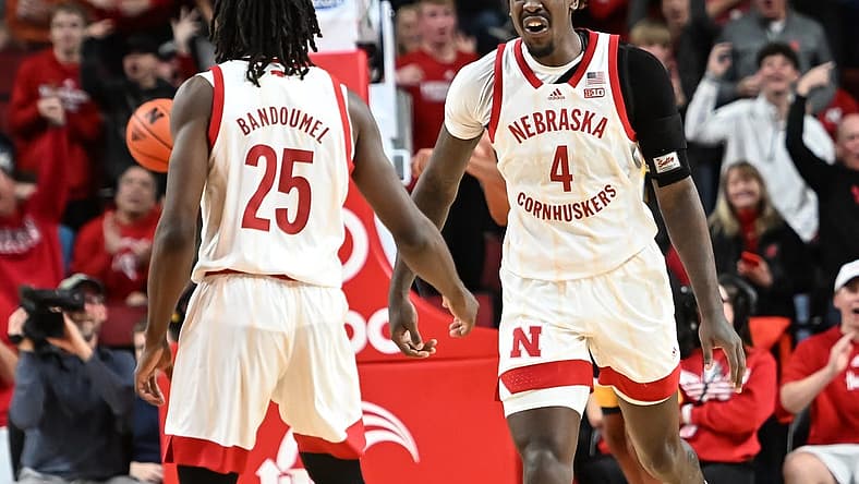 Dec 29, 2022; Lincoln, Nebraska, USA; Nebraska Cornhuskers forward Juwan Gary (4) celebrates a basket with guard Emmanuel Bandoumel (25) in the second half against the Iowa Hawkeyes at Pinnacle Bank Arena. Mandatory Credit: Steven Branscombe-USA TODAY Sports