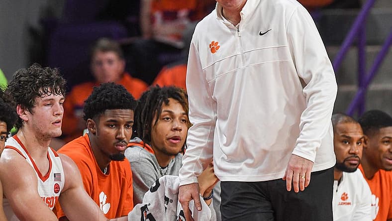 Dec 30, 2022; Clemson, South Carolina, USA; Clemson Head Coach Brad Brownell talks with sophomore forward PJ Hall (24) as the team plays North Carolina State Wolfpack during the first half at Littlejohn Coliseum. Mandatory Credit: Ken Ruinard-USA TODAY Sports