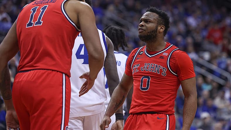Dec 31, 2022; Newark, New Jersey, USA; St. John's Red Storm guard Posh Alexander (0) reacts after a basket by center Joel Soriano (11) during the first half against the Seton Hall Pirates at Prudential Center. Mandatory Credit: Vincent Carchietta-USA TODAY Sports