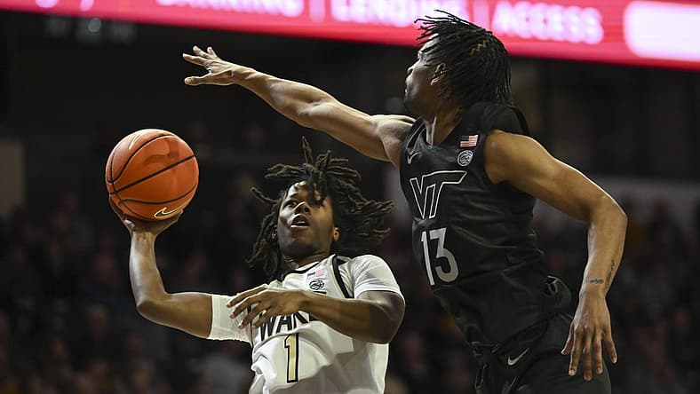 Dec 31, 2022; Winston-Salem, North Carolina, USA; Wake Forest Demon Deacons guard Tyree Appleby (1) shoots over Virginia Tech Hokies guard Darius Maddox (13) during the first half at Lawrence Joel Veterans Memorial Coliseum. Mandatory Credit: William Howard-USA TODAY Sports