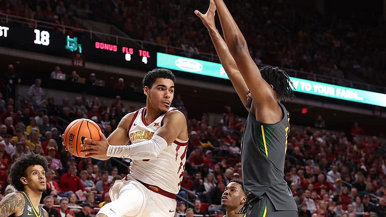Dec 31, 2022; Ames, Iowa, USA; Baylor Bears forward Flo Thamba (0) defends Iowa State Cyclones guard Tamin Lipsey (3) at James H. Hilton Coliseum. Mandatory Credit: Reese Strickland-USA TODAY Sports