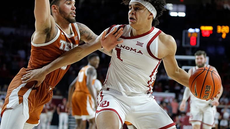 Oklahoma Sooners forward Jalen Hill (1) tries top get past Texas Longhorns forward Timmy Allen (0) during an NCAA men's college basketball game between the University of Oklahoma and Texas at Lloyd Noble Center in Norman, Okla., Saturday, Dec. 31, 2022. Texas won 70-69.
Oklahoma Vs Texas Basketball