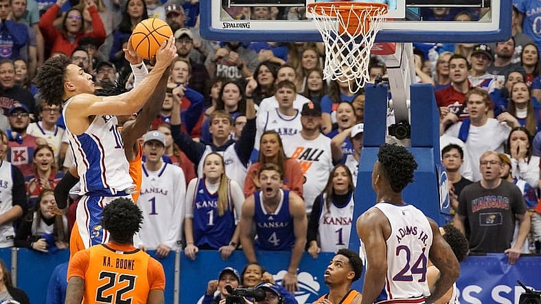 Dec 31, 2022; Lawrence, Kansas, USA; Kansas Jayhawks forward Jalen Wilson (10) rebounds against the Oklahoma State Cowboys during the second half at Allen Fieldhouse. Mandatory Credit: Denny Medley-USA TODAY Sports
