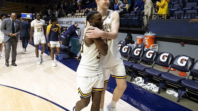 Dec 31, 2022; Berkeley, California, USA; California Golden Bears guard DeJuan Clayton (33) and forward Lars Thiemann (21) embrace after defeating the Colorado Buffaloes at Haas Pavilion. California won 80-76. Mandatory Credit: D. Ross Cameron-USA TODAY Sports