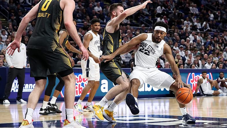 Jan 1, 2023; University Park, Pennsylvania, USA; Penn State Nittany Lions guard Jalen Pickett (22) dribbles the ball towards the basket during the first half against the Iowa Hawkeyes at Bryce Jordan Center. Mandatory Credit: Matthew OHaren-USA TODAY Sports