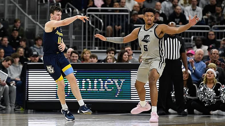 Dec 20, 2022; Providence, Rhode Island, USA; Marquette Golden Eagles guard Tyler Kolek (11) passes the ball during the first half against the Providence Friars at Amica Mutual Pavilion. Mandatory Credit: Eric Canha-USA TODAY Sports