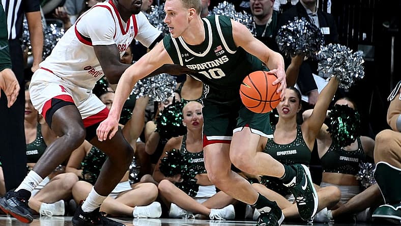 Jan 3, 2023; East Lansing, Michigan, USA; Michigan State Spartans forward Joey Hauser (10) drives past Nebraska Cornhuskers forward Juwan Gary (4) in the first half at Jack Breslin Student Events Center. Mandatory Credit: Dale Young-USA TODAY Sports