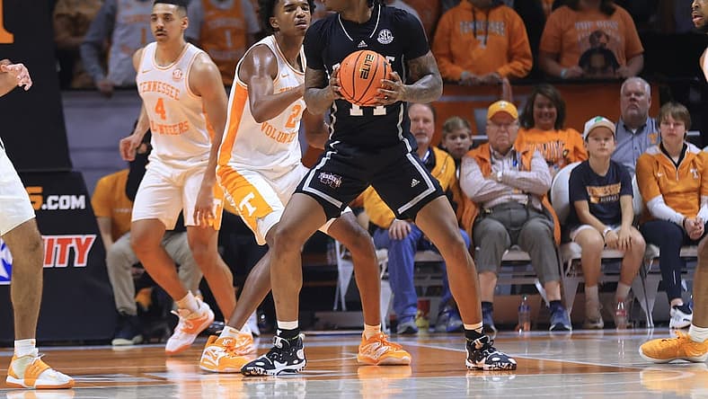 Jan 3, 2023; Knoxville, Tennessee, USA; Mississippi State Bulldogs forward Tyler Stevenson (14) moves the ball against Tennessee Volunteers forward Julian Phillips (2) during the first half at Thompson-Boling Arena. Mandatory Credit: Randy Sartin-USA TODAY Sports