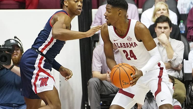 Jan 3, 2023; Tuscaloosa, Alabama, USA; Alabama Crimson Tide forward Brandon Miller (24) drives to the basket against Mississippi Rebels guard Matthew Murrell (11) during the first half at Coleman Coliseum. Mandatory Credit: Marvin Gentry-USA TODAY Sports