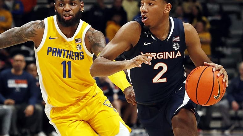 Jan 3, 2023; Pittsburgh, Pennsylvania, USA;  Virginia Cavaliers guard Reece Beekman (2) drives to the basket against Pittsburgh Panthers guard Jamarius Burton (11) during the first half at the Petersen Events Center. Mandatory Credit: Charles LeClaire-USA TODAY Sports