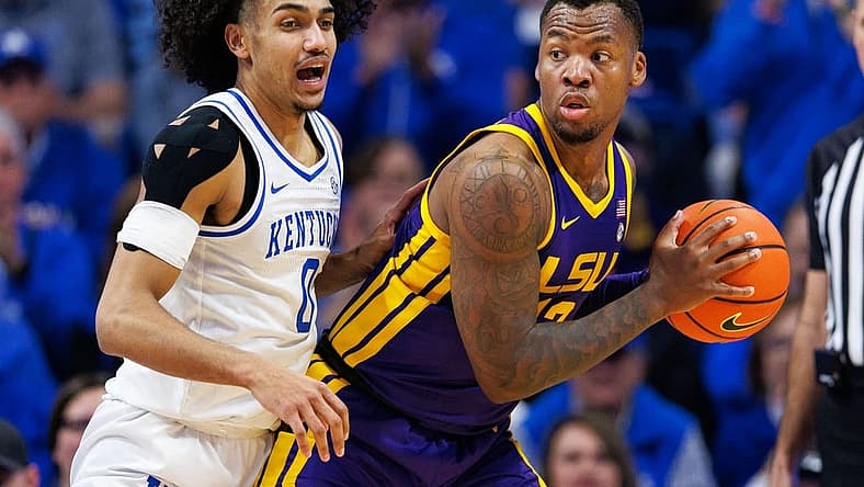 Jan 3, 2023; Lexington, Kentucky, USA; LSU Tigers forward KJ Williams (12) handles the ball during the second half against the Kentucky Wildcats at Rupp Arena at Central Bank Center. Mandatory Credit: Jordan Prather-USA TODAY Sports