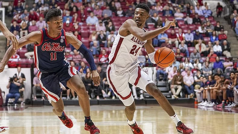 Jan 3, 2023; Tuscaloosa, Alabama, USA; Alabama Crimson Tide forward Brandon Miller (24) drives to the basket against Mississippi Rebels guard Matthew Murrell (11) during the second half at Coleman Coliseum. Mandatory Credit: Marvin Gentry-USA TODAY Sports
